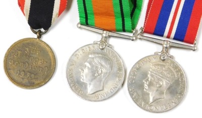 A WWII Third Reich War Merit Medal, with a War Merit Cross ribbon, together with a British Defence Medal, and a 1939-45 War Medal. (3) - 2