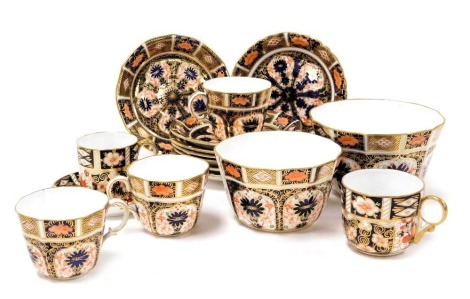 A group of Royal Crown Derby Imari porcelain, pattern no. 1128, comprising two graduated sugar bowls, three tea cups and eight saucers, an Imari coffee can and saucers, pattern 2451, and a coffee cup. (a quantity)