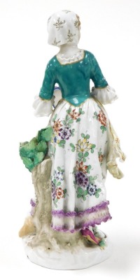 A late 19thC Samson porcelain figure, of a shepherdess, holding a tambourine, with a lamb at her feet, raised on a floral encrusted rococo base, gold anchor mark, 24cm high. - 2