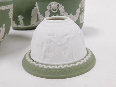 A group of Wedgwood green Jasperware, including two fruit bowls, small jardiniere, and a teapot, together with a night light. (a quantity) - 3