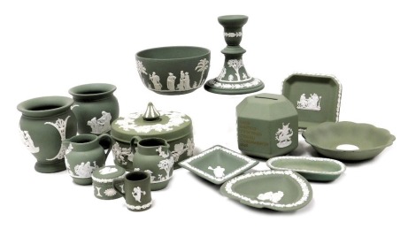 A group of Wedgwood green Jasperware, including a hexagonal money box, bowl, vases, dressing table box and cover, candlestick, trinket dishes, etc. (a quantity)