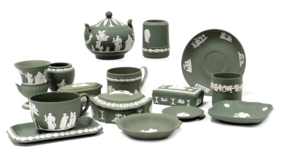 A group of Wedgwood green Jasperware, including trinket boxes and dishes, small vases, sucrier and cover, tea cup and saucer. (a quantity)