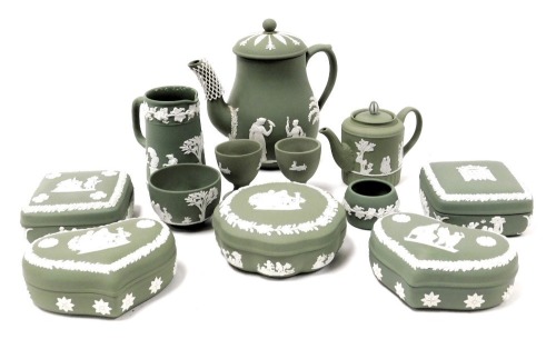 A group of Wedgwood green Jasperware, including dressing table boxes and covers, coffee pot and cover, egg cups, square box and cover bearing the crest of the Tudor Portcullis, Palace of Westminster, and a small milk jug. (a quantity)