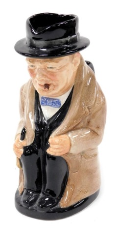 A Royal Doulton pottery character jug, modelled as Winston Churchill, in seated pose, printed marks, 21.5cm high.