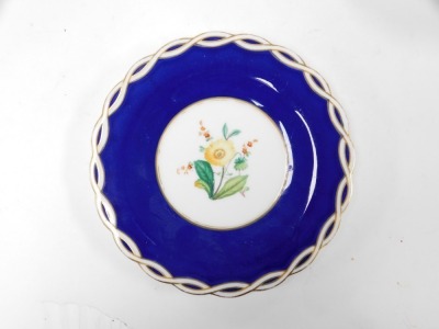 A late 19thC porcelain part dessert service, painted with flowers against a cobalt blue ground, bears impressed registration lozenge, pattern number A1353, painted marks, comprising pair of oval footed dishes and nine plates. - 2