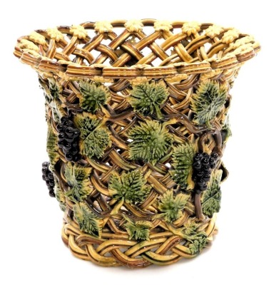 A late 19thC pottery basket, or wine cooler, of open lattice work form, moulded with repeating vines, 22cm high.