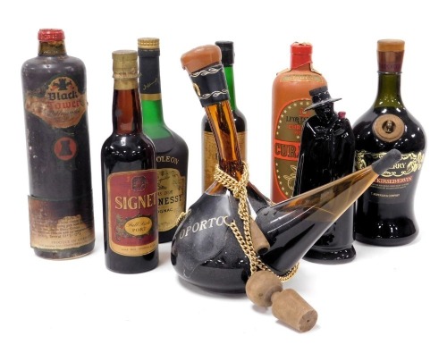 A bottle of Hennesy Napoleon Cognac, bottle number 251734, Wade Sandiman's Port black figural decanter, all with contents, Cygnet Port, Danish Kris Berry Morey Curacao, etc. (a quantity)