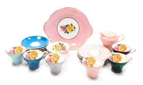 An Aynsley porcelain harlequin part tea service, decorated with roses, comprising cream jug and sugar bowl, bread plate, six tea cups, saucers and plates.