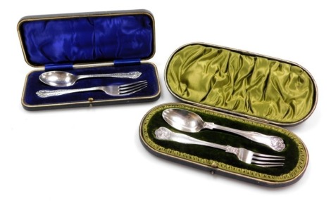 A Victorian silver Shell pattern fork and spoon, monogram engraved, cased, John Round & Son Ltd, Sheffield 1901, together with an Edward VII silver fork and spoon, cased, Sheffield 1903, 4.21oz.