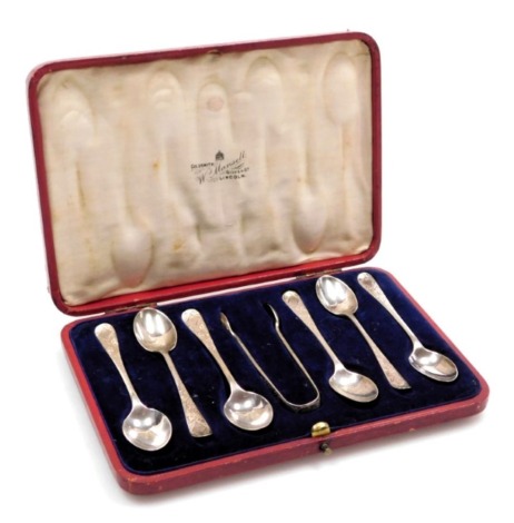 A set of Six Edward VII silver coffee spoons, and a pair of sugar tongs, with foliate engraving, vacant reserve, cased, Sheffield 1907, 2.04oz.