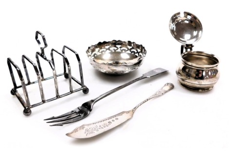 A group of small silver, comprising; a George V four division toast rack, London 1929, pierced circular sweetmeat dish, Birmingham 1928, Victorian toasting fork, monogram engraved, London 1897, butter knife, Birmingham 1896, and a George VI mustard pot, l