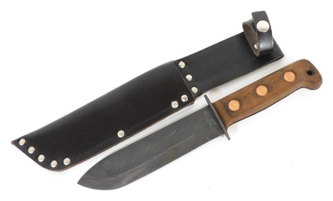 A British Army survival knife 1993, serial number 127 8214, JA 1993/1, with sheath, 33cm wide.