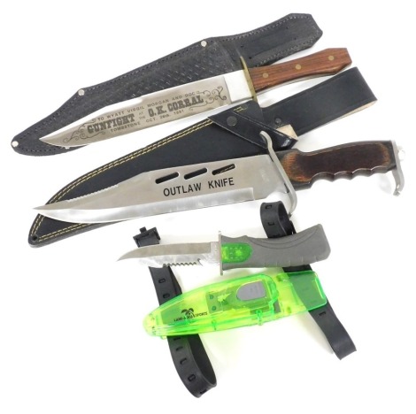 A group of three knives, comprising an outlaw knife, OK Corral commemorative knife, and a diving knife. (3)