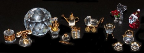 A group of Swarovski crystal, including a 50th anniversary of The Coronation of Queen Elizabeth II paperweight, Father Christmas, bear with flowers, and Crystal Memories Classics, all boxed. (12)