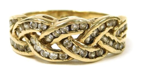 A 9ct gold and CZ ring, in a channelled and plaited design, size Q, 3.8g.