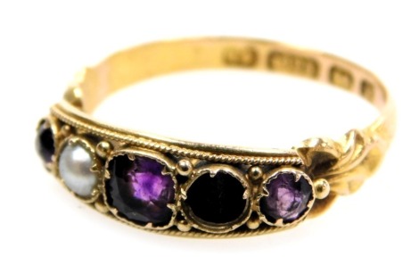 A 15ct gold, amethyst and seed pearl five stone ring, one pearl lacking, size N, 2.0g.