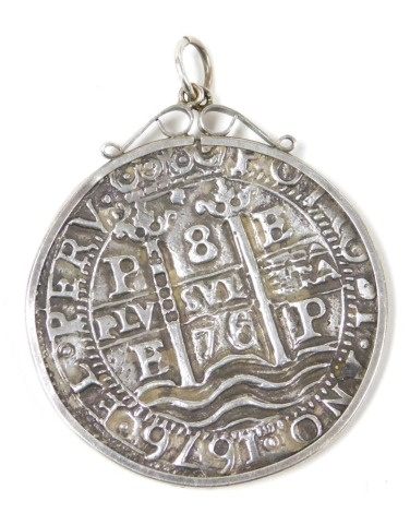 A Bolivian Carlos II 8 reales silver coin, in a pendant mount, stamped silver.