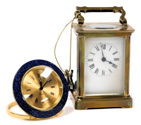 A brass carriage clock, rectangular dial bearing Roman numerals, single barrel movement, the case of conventional form, with key, 11.5cm high, together with a Luxor strut bedroom clock with a quartz movement, the case in a faux lapis lazuli surround, case