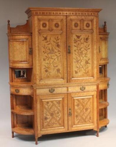 A Victorian birds eye maple cabinet by William Watt