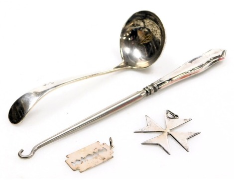 A George V silver cream ladle, Sheffield 1910, George V silver handled button hook, Sheffield 1919, Maltese Cross pendant, white metal stamped 917, and a pendant formed as a razor blade, stamped silver, 2.03oz all in.