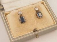 A pair of sapphire and diamond set pendant drop earrings