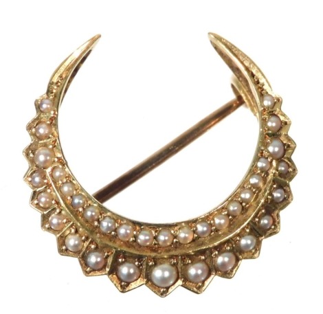 A Victorian seed pearl set crescent moon brooch, in yellow metal, stamped 15ct, 3.4g.