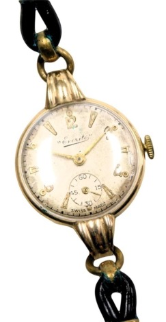 An Everite lady's 9ct gold cased wristwatch, circular silvered dial bearing Arabic numerals at evens, subsidiary seconds dial, fifteen jewelled movement, the case of plain form, on a leather strap.