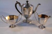 A George V silver three piece tea service of octagonal form