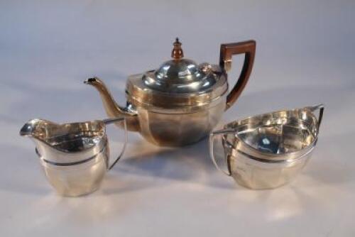 A George V silver three piece tea service of ovoid form by The Barker Brothers