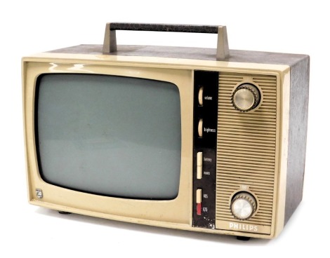 A Philips vintage portable television, in a mushroom coloured plastic and faux skin casing, 38cm wide.