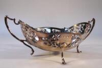 A George V silver oval pierced cake basket on scrolled feet by Fenton Brothers