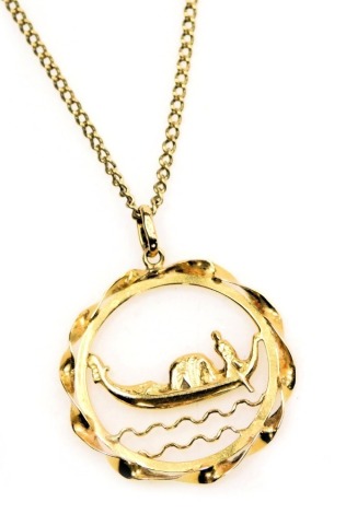 A circular pendant, cast with a gondola on two bands of waves, yellow metal, stamped 750, on a 9ct gold curb link neck chain, with bolt ring clasp, 9.8g.