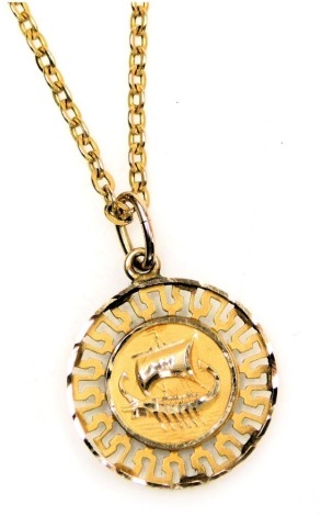 A Greek circular yellow metal pendant, embossed centrally with an outline of Corfu, on a belcher link neck chain, 4.4g all in.