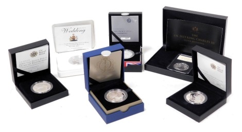 A King Charles III silver Britannia 2023, five pound silver proof coins, for the Christening of HRH Prince George of Cambridge, HRH The Prince Phillip, Duke of Edinburgh 2011, Queen's Diamond Jubilee, Restoration of The Monarchy 2010, and The Wedding of P