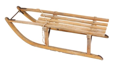 A vintage Greys of Cambridge Tabos single sledge, 95cm long.