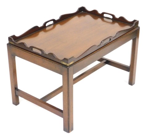 A Georgian style mahogany tray top silver table, raised on channelled square legs, united by a H frame stretcher 50cm high, 76cm wide, 50.5cm deep.