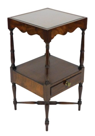 A early 19thC Georgian mahogany wash stand, with a solid top raised on turned supports united by an under tier with a frieze drawer, united by a X frame stretcher, 77.5cm high, 41cm wide, 40.5cm deep.