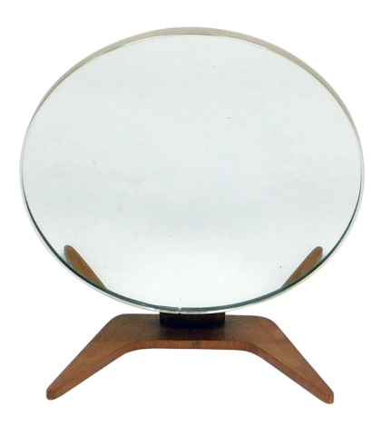 A vintage 1960s teak framed vanity mirror, with a circular hinged mirror, raised on a v shaped base, 48cm high.