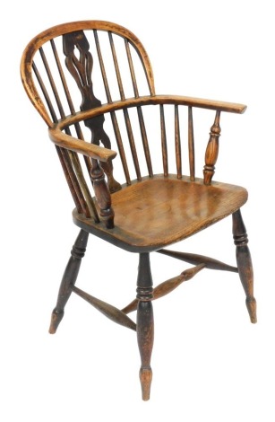 A 19thC Lincolnshire ash and elm low back Windsor chair, with shaped back, plain spindles, C shaped arms, turned supports, shaped seat, and single ring turned front legs, joined by a H stretcher, 89cm high.