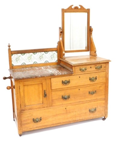 A Victorian satin walnut bedroom chest, with a swing frame mirror, marble top wash stand with tiled splash back, above a cupboard one short two medium and one long drawer, on castors, 146cm high, 126cm wide, 50cm deep.