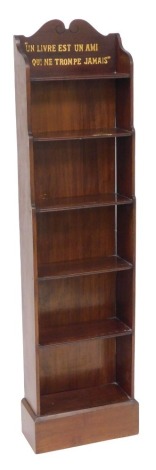 A late Victorian mahogany narrow bookcase, of five shelves, raised on a plinth base, the top painted with "Un livre est un ami qui ne trompe jamis", 139cm high, 35cm wide, 18.5cm deep.