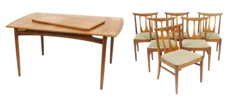 A G Plan teak draw leaf dining table, raised on turned legs, 73cm high, 146cm wide, 192cm extended 89cm deep, together with six single dining chairs.