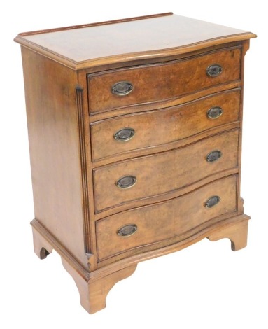 A Georgian style burr walnut serpentine chest, of four long graduated drawers, raised on bracket feet 75.5cm high, 61cm wide, 43.5cm deep.