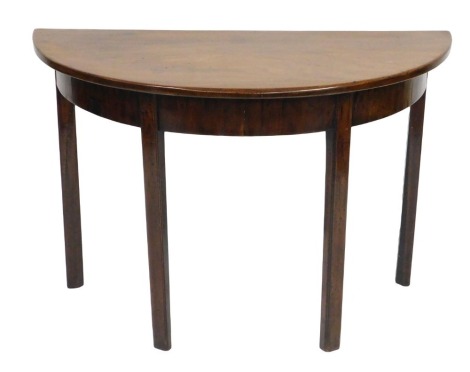 A George III mahogany D-end table, raised on channelled square legs, 70cm high, 107cm wide, 51cm deep.