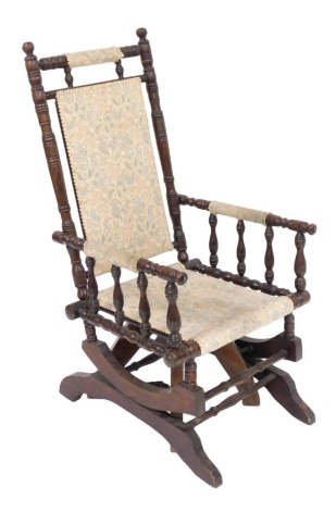 An American beech rocking chair, with upholstered seat and back, 55cm wide.