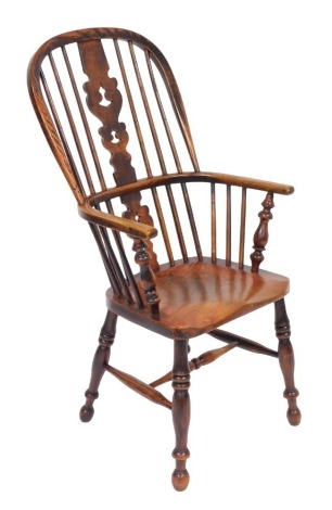 A 19thC oak and elm Windsor chair, with a vase shaped splat, solid saddle seat, raised on turned legs united by a H frame stretcher, 55cm wide.