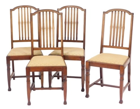 A set of four Victorian mahogany dining chairs with floral pattern drop in seats.