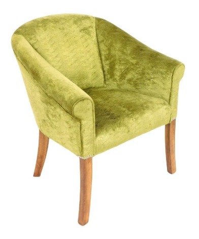 A modern tub armchair, upholstered in lime green fabric, raised on outswept legs 72cm wide.