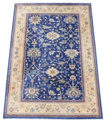 A Royal Kashan Agra pattern blue ground rug, 196cm x 140cm.