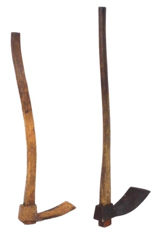 Two wooden handled mattocks.